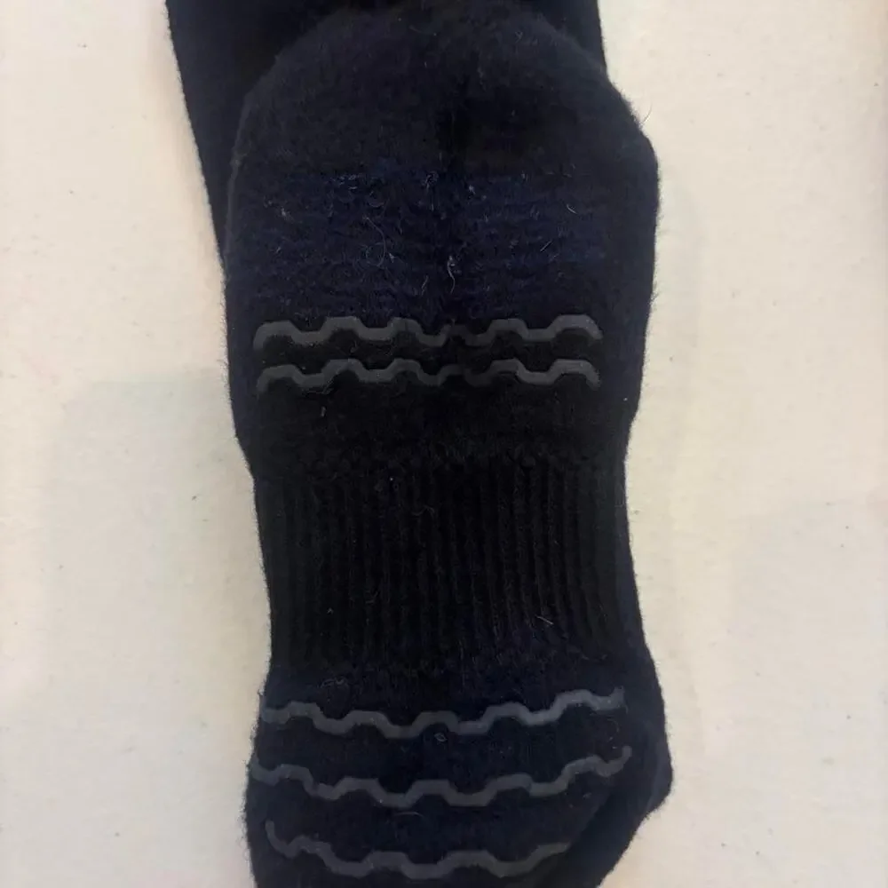 Apollo grip socks with wavy gray stripes on the sole